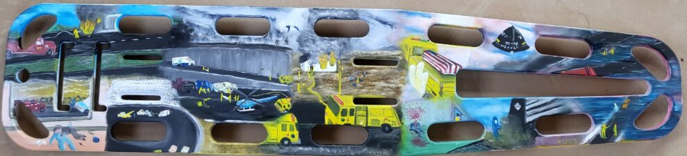 "Career" - Witnessing 30 years of dedicated service, this mural is painted on an EMS backboard that was personally used in my career. It captures 10 defining moments from my journey in emergency response. It's a tribute to the calls answered, the challenges faced, and the enduring spirit of those who serve, carrying both the visible and unseen burdens. Signed TLM.